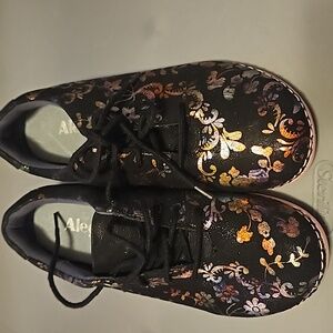 Alegria black with pink accents and metallic design